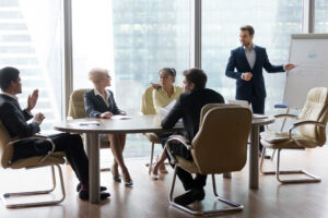 Successful team leader businessman boss presenting new project 1050287518 5386x3591 2